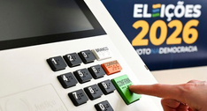 A imagem mostra a urna eletrônica. O teclado numérico apresenta teclas pretas com números em rel...